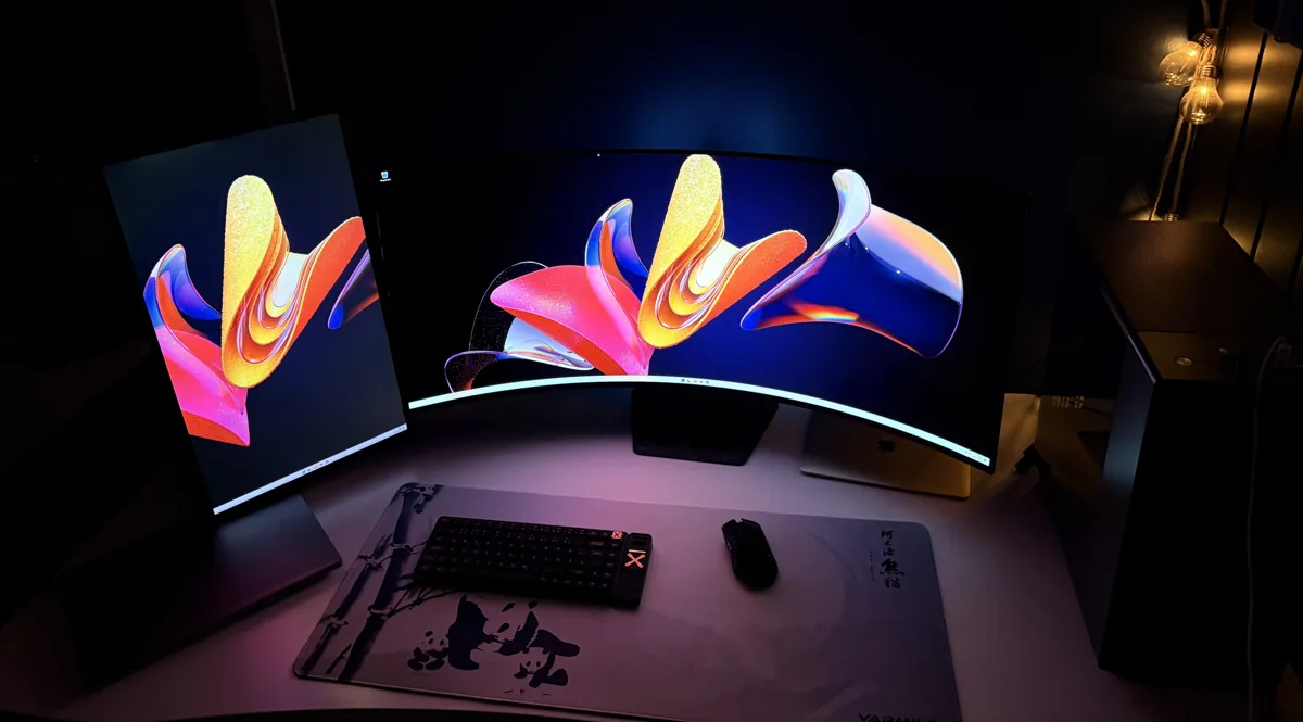 Henry's workstation with ultrawide and portrait monitors